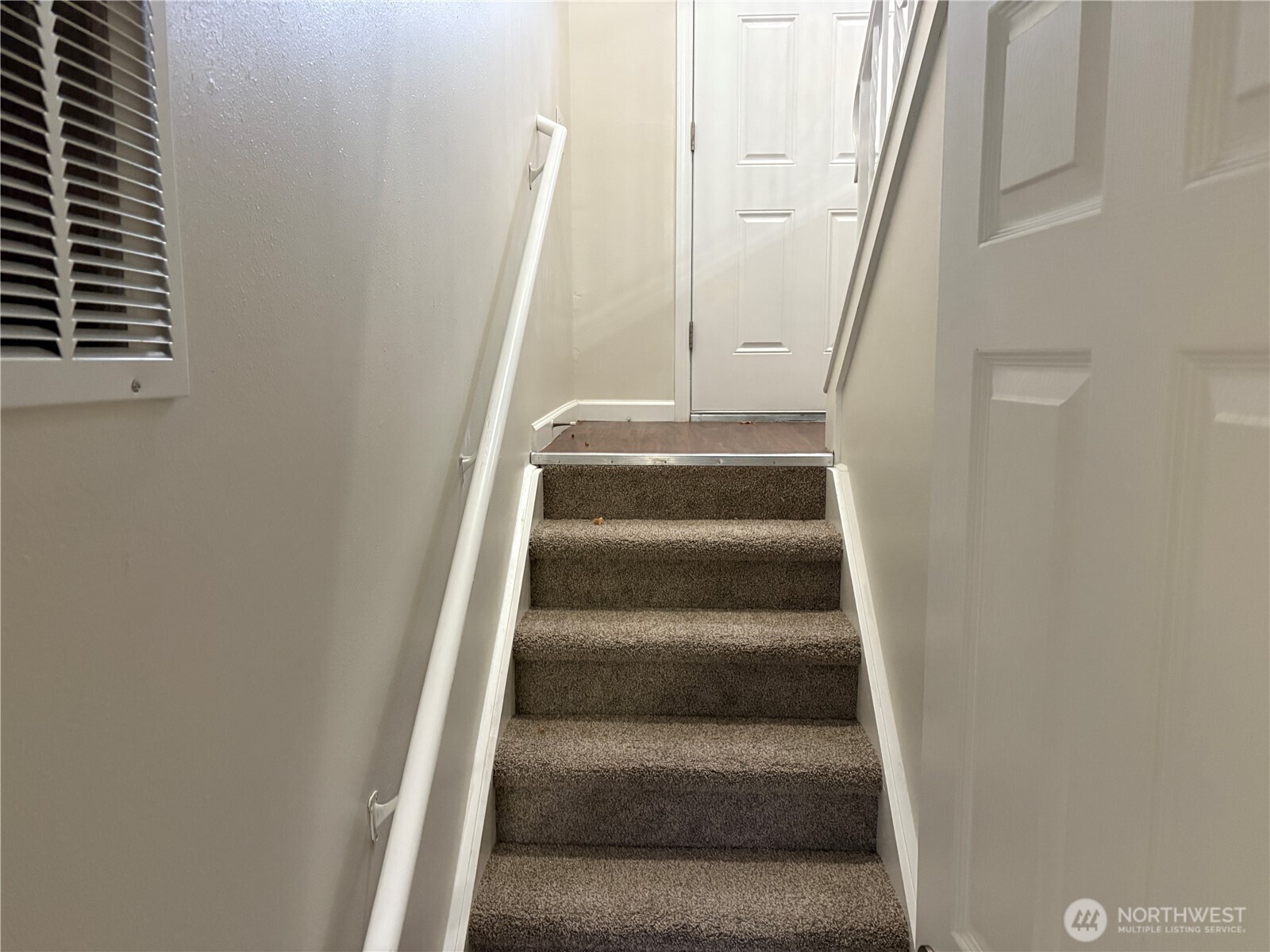 16312 127th Place Southeast Renton, WA 98058 - Photo 16 of 25 a view of staircase with white walls