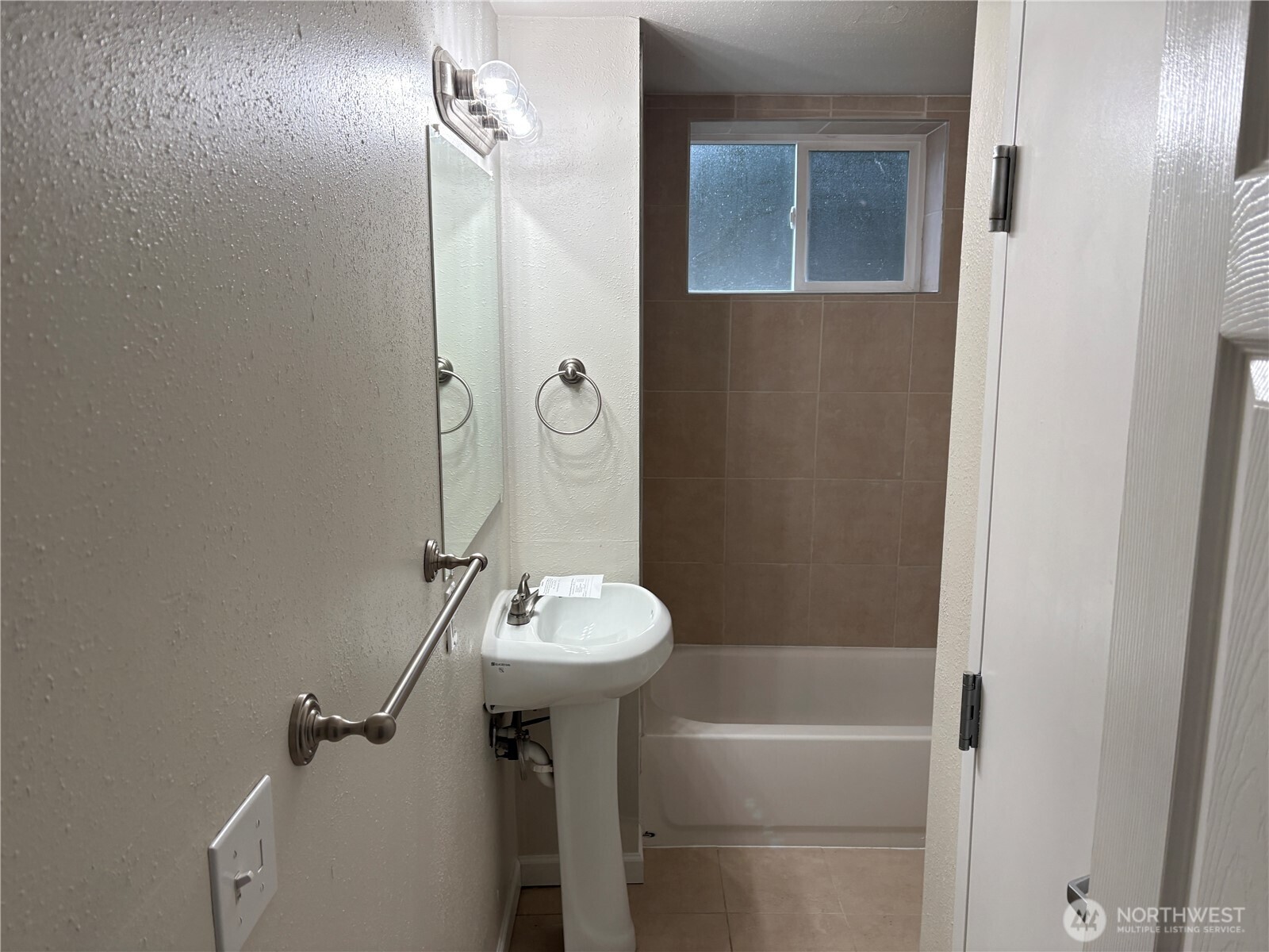 16312 127th Place Southeast Renton, WA 98058 - Photo 19 of 25 a bathroom with a sink a toilet and shower