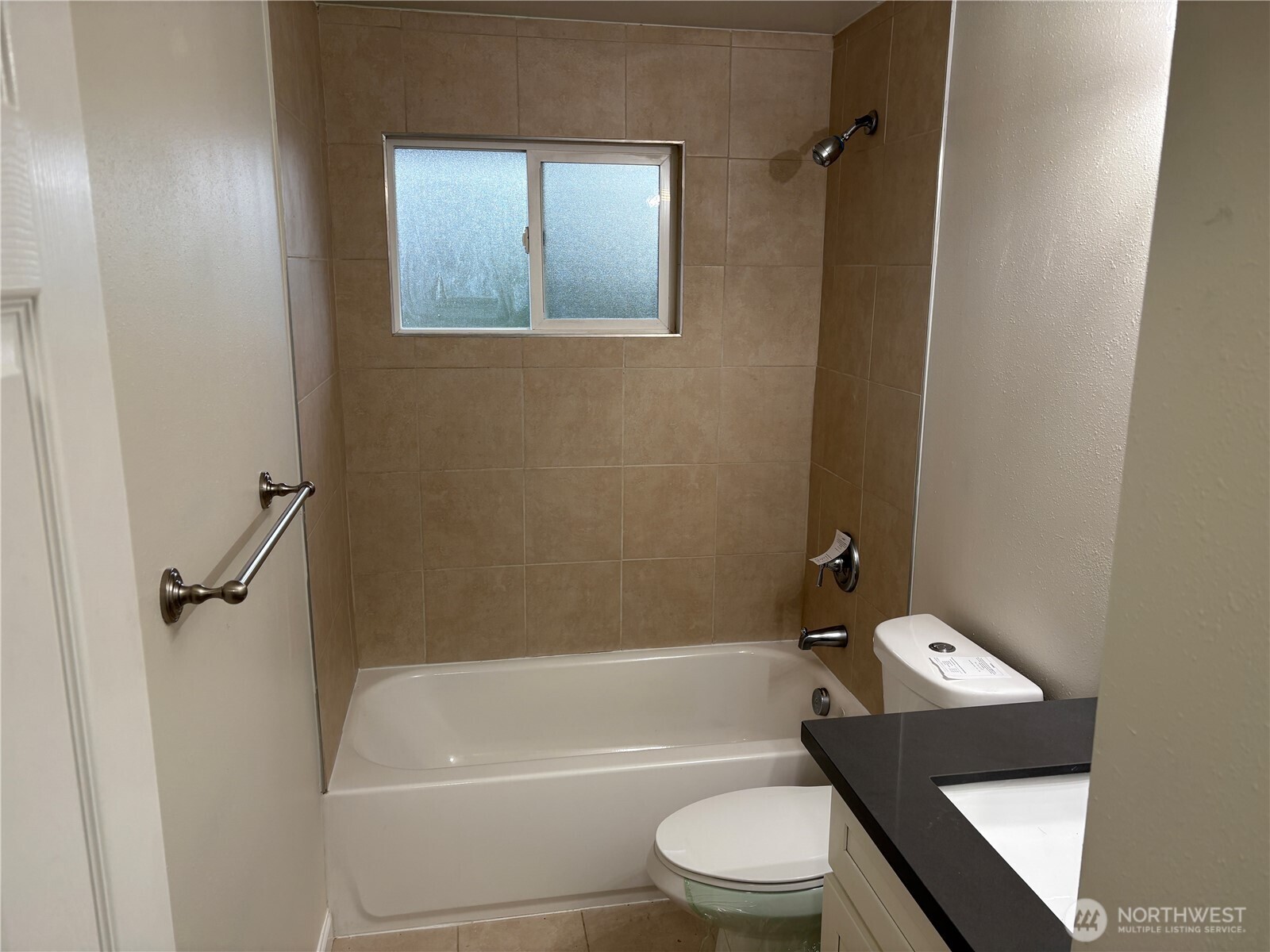 16312 127th Place Southeast Renton, WA 98058 - Photo 9 of 25 a bathroom with a toilet and a tub