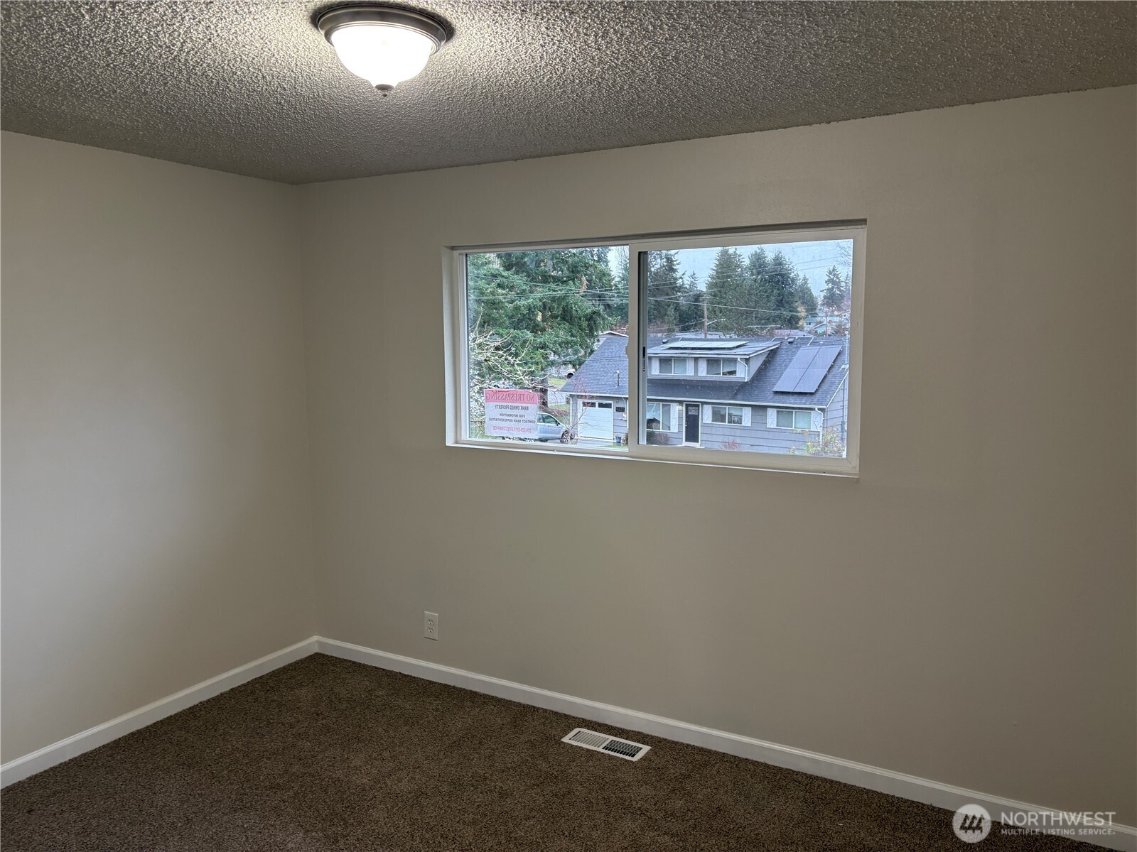16312 127th Place Southeast Renton, WA 98058 - Photo 10 of 25 an empty room with a window