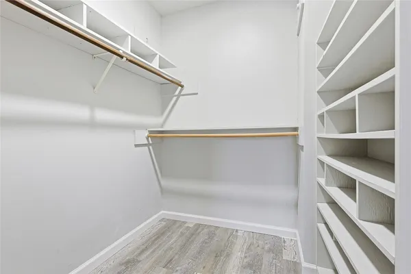 a view of an empty walk in closet