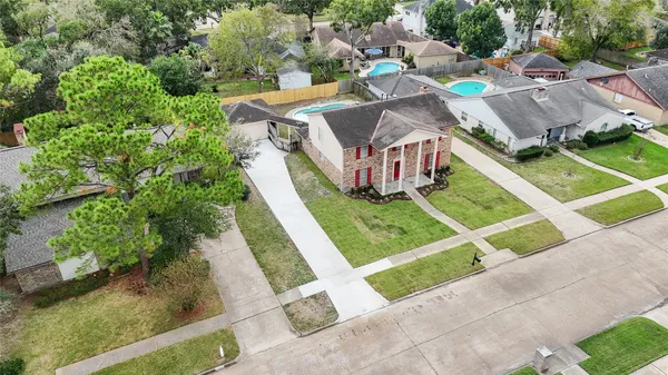 an aerial view of a house with outdoor space