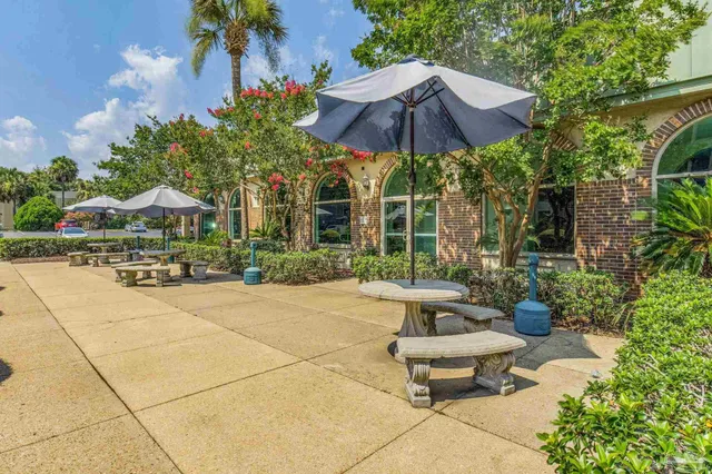 a view of a backyard with sitting area and furniture
