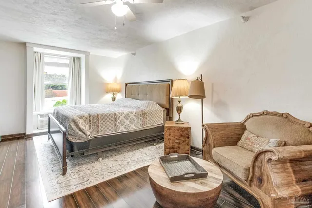 a bedroom with a bed and a couch