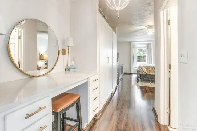 wooden floor in a kitchen with a mirror and a sink