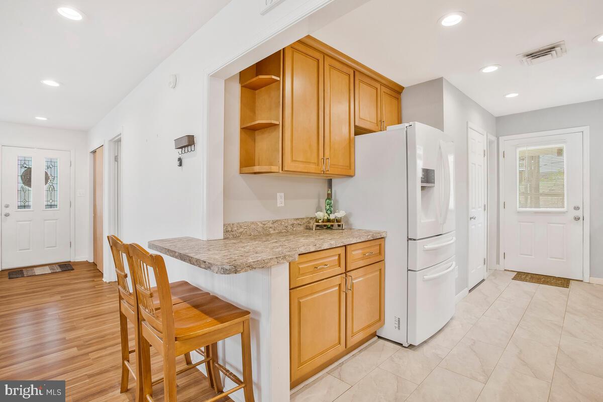391 Red Cloud Road Lusby, MD 20657 - Photo 17 of 39 Kitchen barstool area.