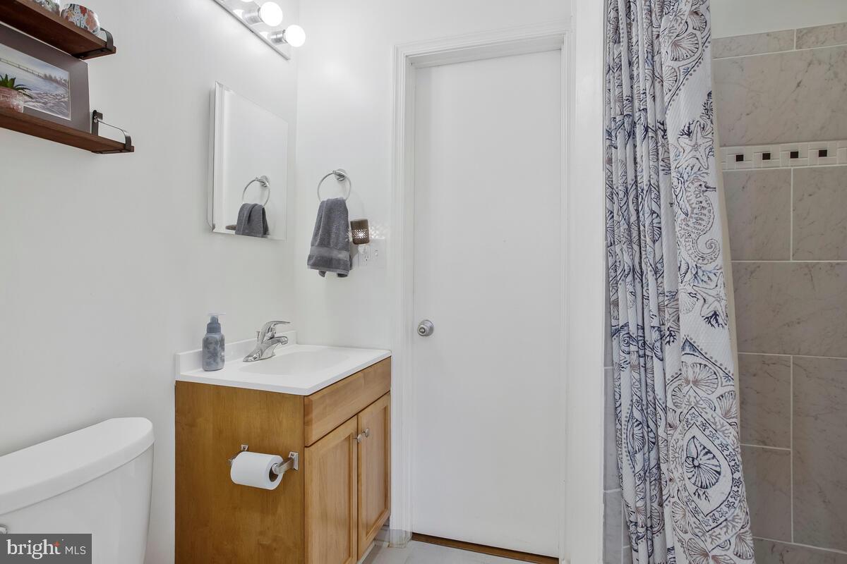 391 Red Cloud Road Lusby, MD 20657 - Photo 29 of 39 Jack-n-Jill bath with full modern shower.