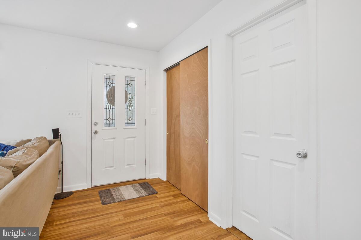391 Red Cloud Road Lusby, MD 20657 - Photo 32 of 39 Front door entrance with coat closet.