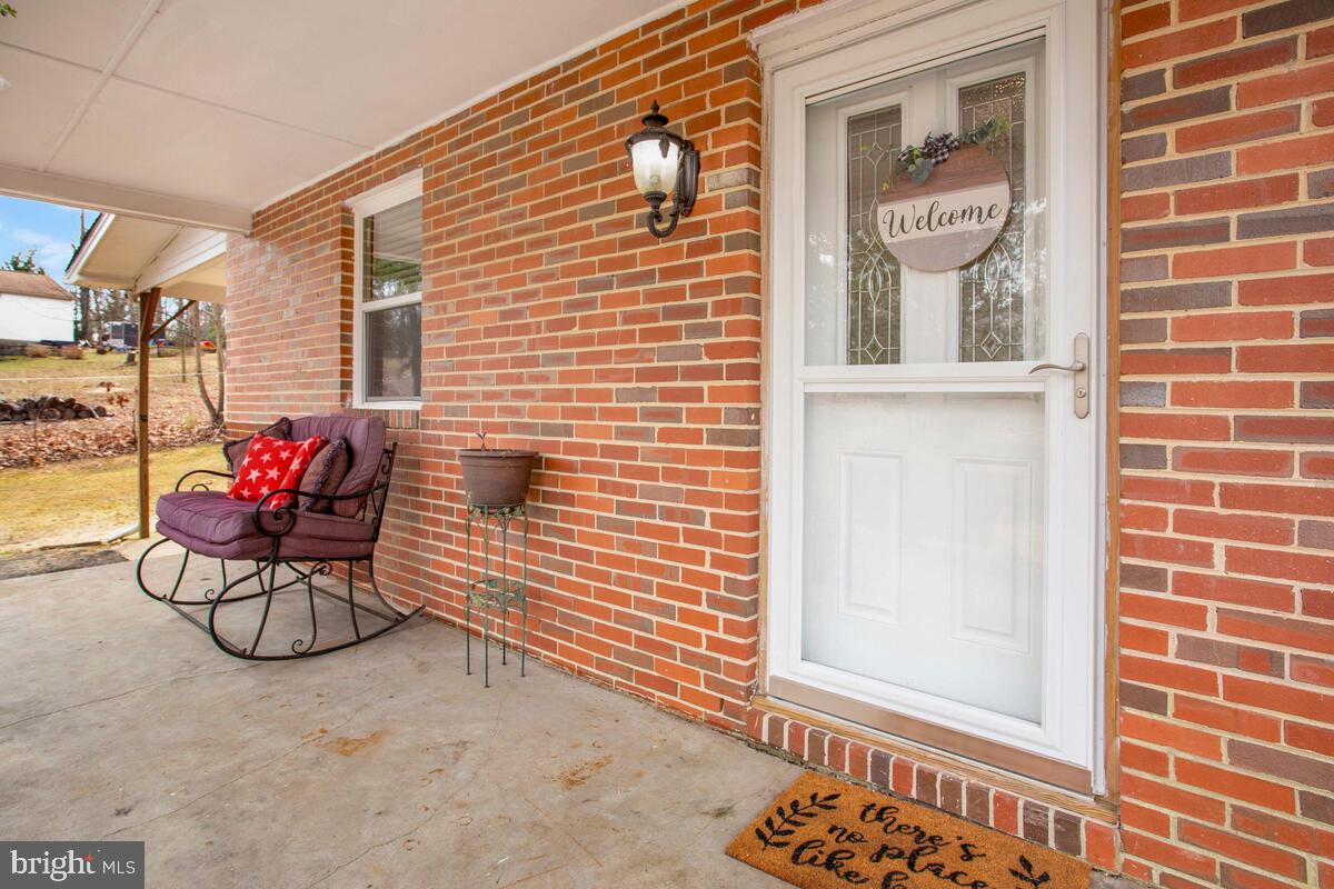 391 Red Cloud Road Lusby, MD 20657 - Photo 7 of 39 What, packages aren't wet!! Covered porch.