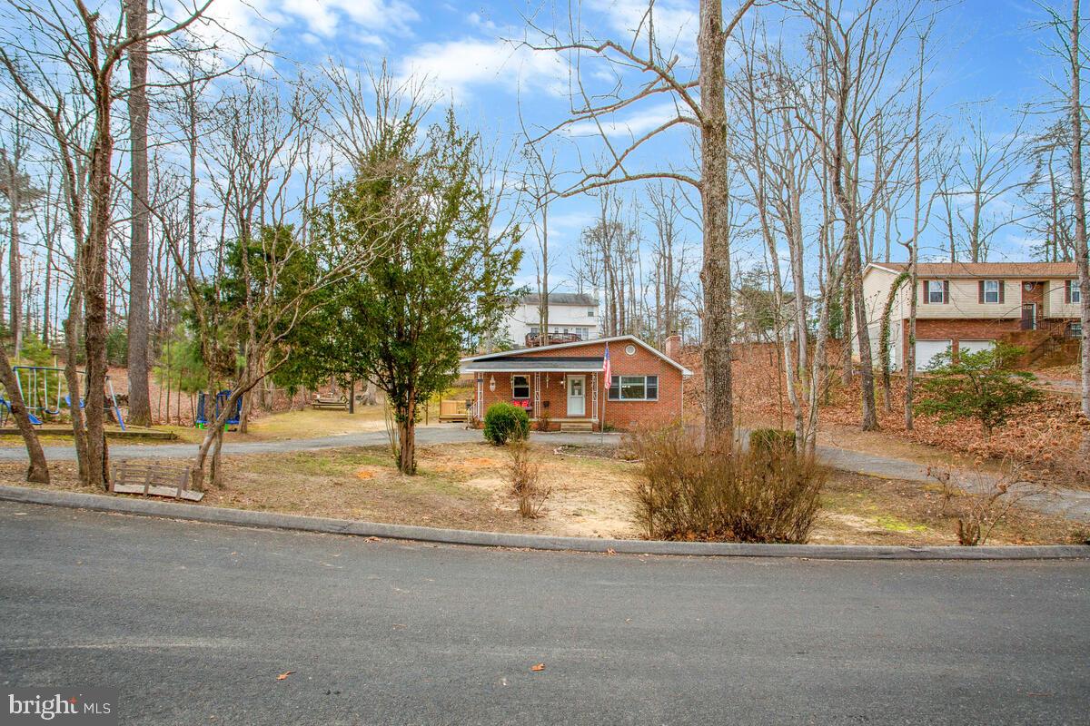 391 Red Cloud Road Lusby, MD 20657 - Photo 8 of 39 Circular driveway view from quiet street.