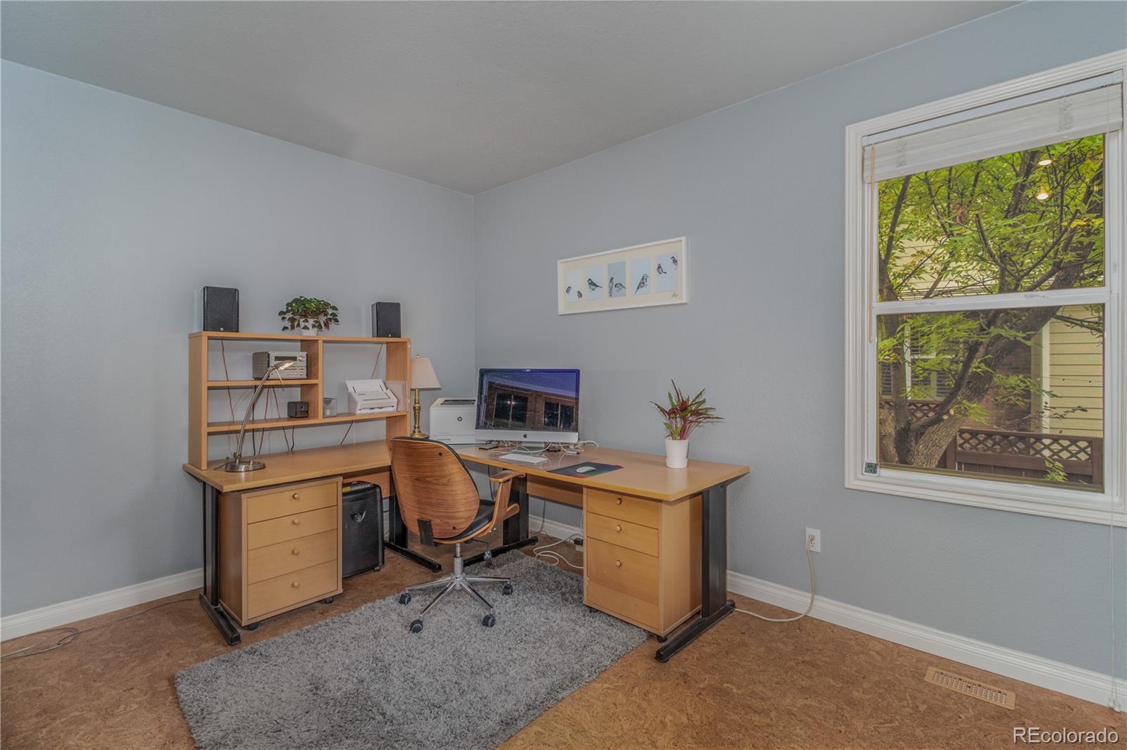 3940 Montclair Lane Boulder, CO 80301 - Photo 11 of 26 a view of a workspace with furniture and a window