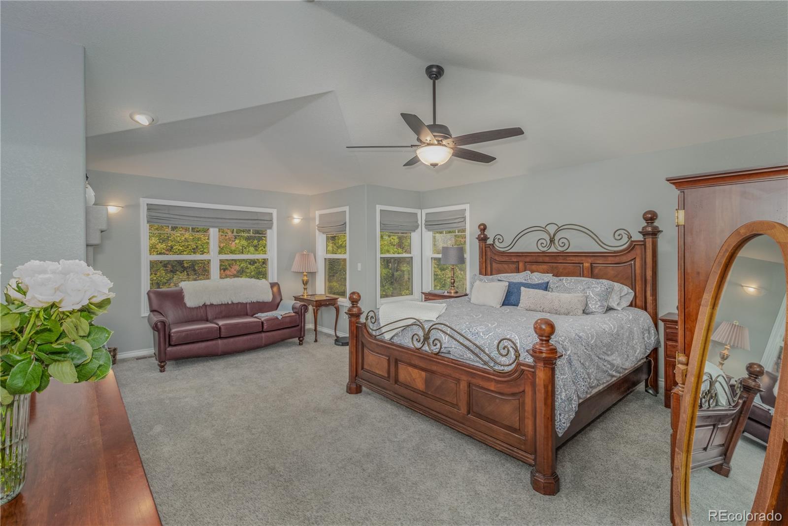 3940 Montclair Lane Boulder, CO 80301 - Photo 12 of 26 a bed room with a bed and a chandelier