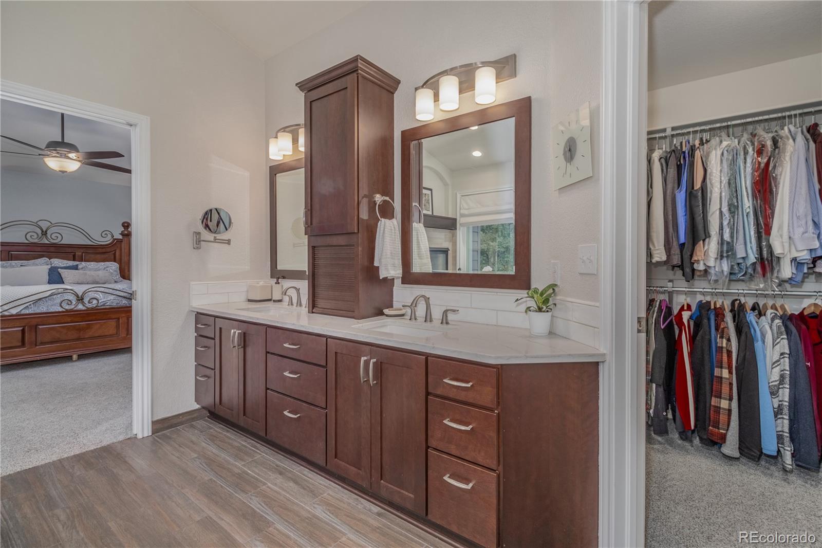 3940 Montclair Lane Boulder, CO 80301 - Photo 13 of 26 a spacious bathroom with a double vanity sink and a mirror