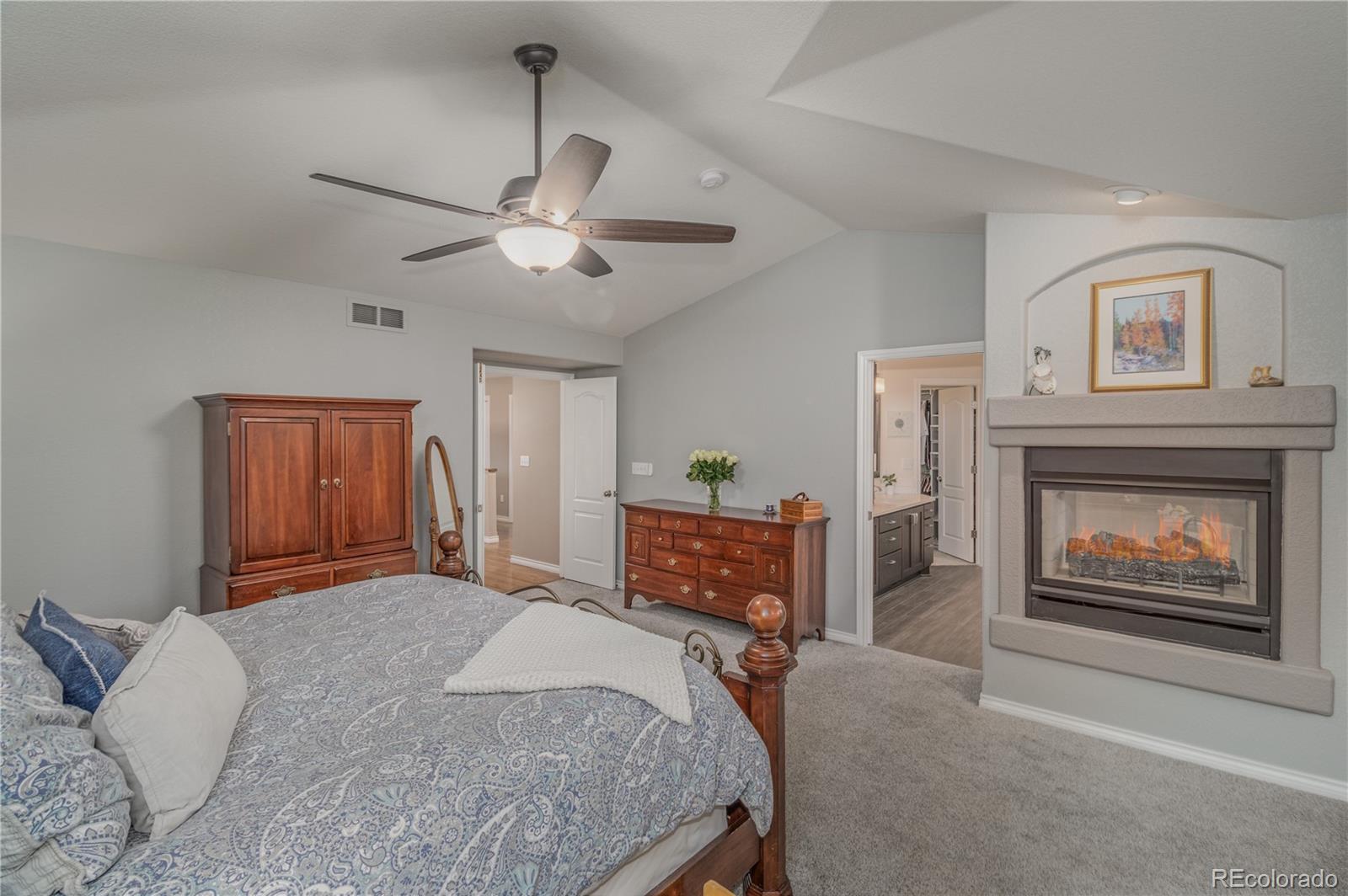 3940 Montclair Lane Boulder, CO 80301 - Photo 14 of 26 a bedroom with a bed and a fireplace