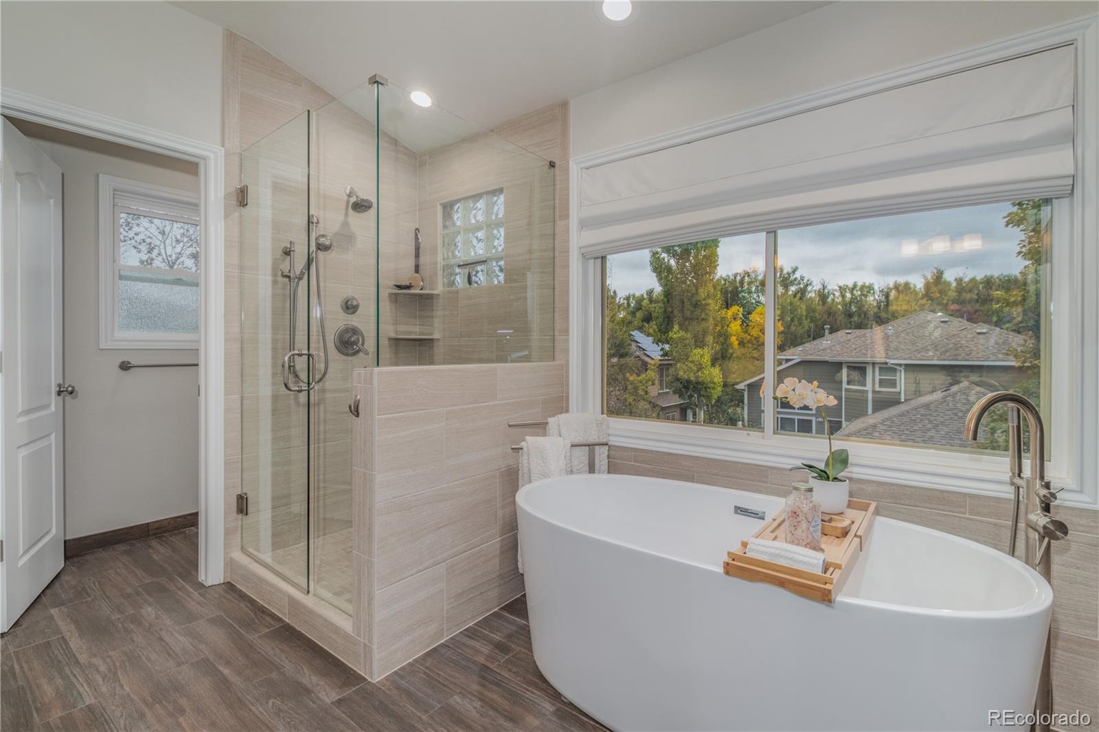 3940 Montclair Lane Boulder, CO 80301 - Photo 15 of 26 a bathroom with a tub and shower