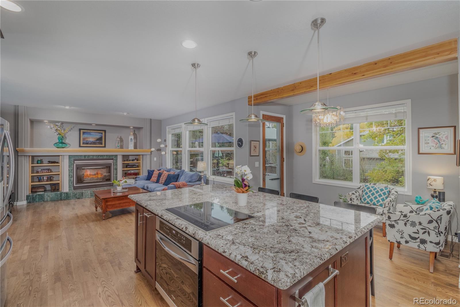 3940 Montclair Lane Boulder, CO 80301 - Photo 6 of 26 a kitchen with stainless steel appliances granite countertop a granite counter tops and a view of living room