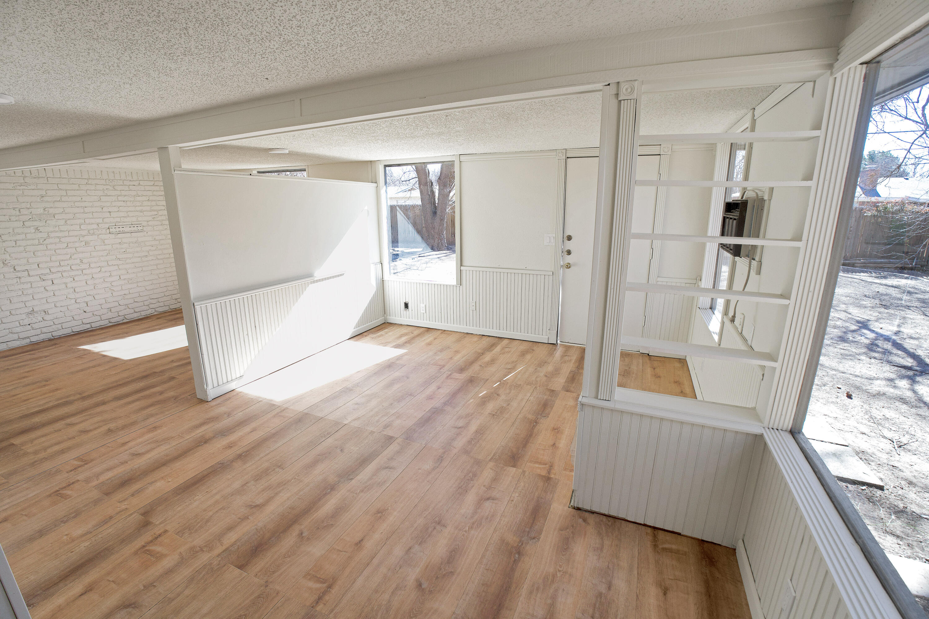 3827 52nd Street Lubbock, TX 79413 - Photo 18 of 24 a view of empty room with wooden floor and fan