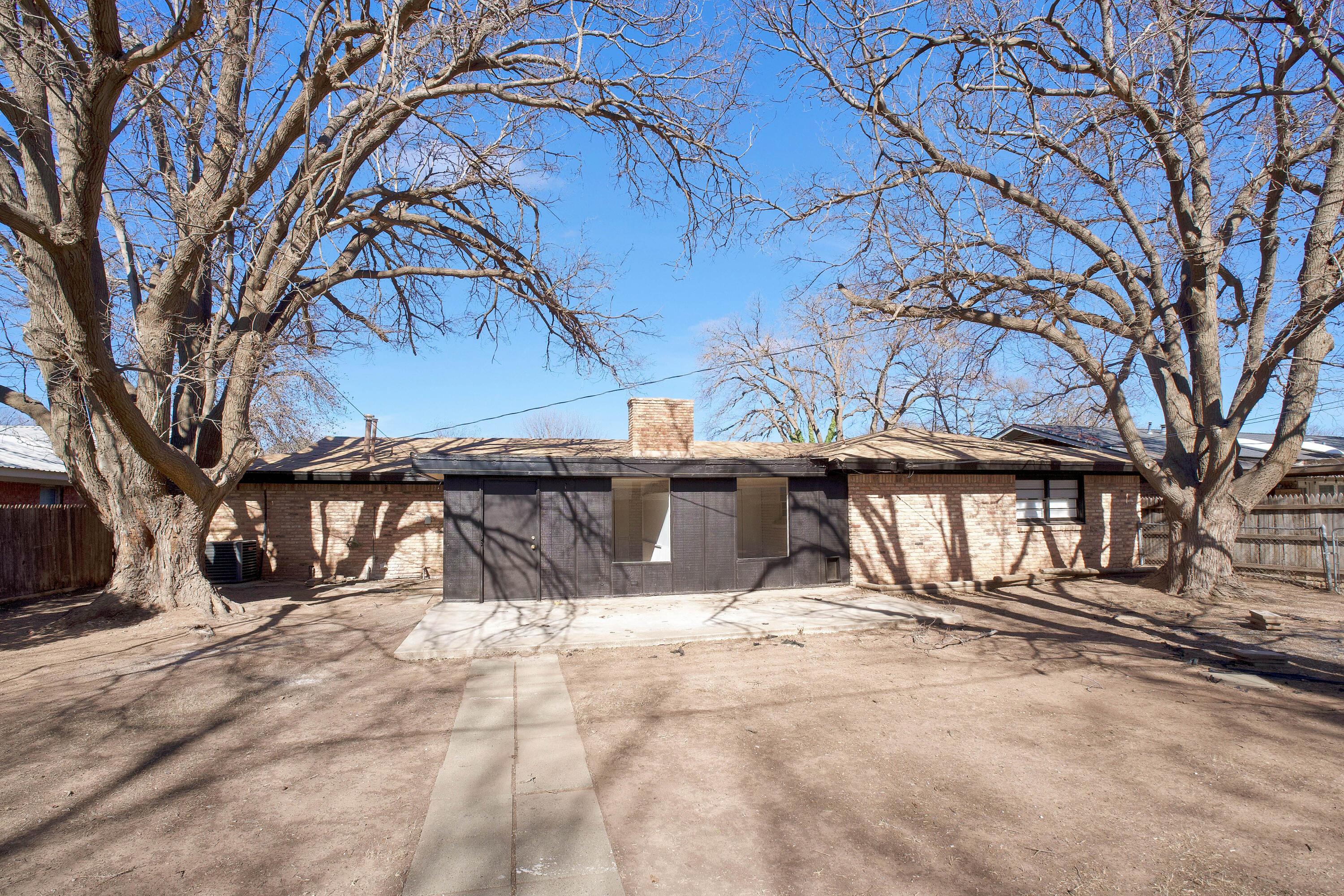 3827 52nd Street Lubbock, TX 79413 - Photo 21 of 24 a view of a house with a snow in the yard