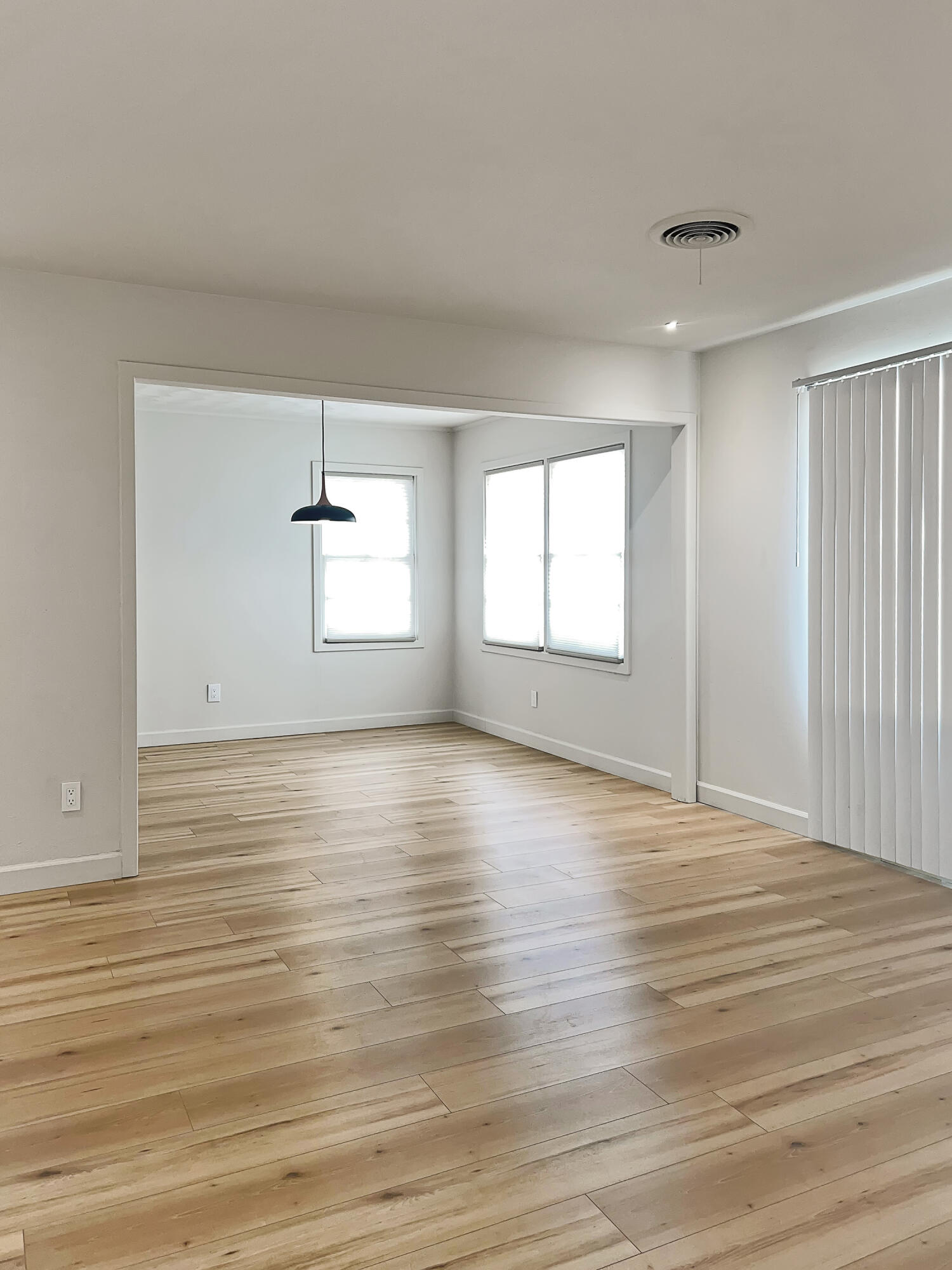 3827 52nd Street Lubbock, TX 79413 - Photo 24 of 24 an empty room with wooden floor and windows