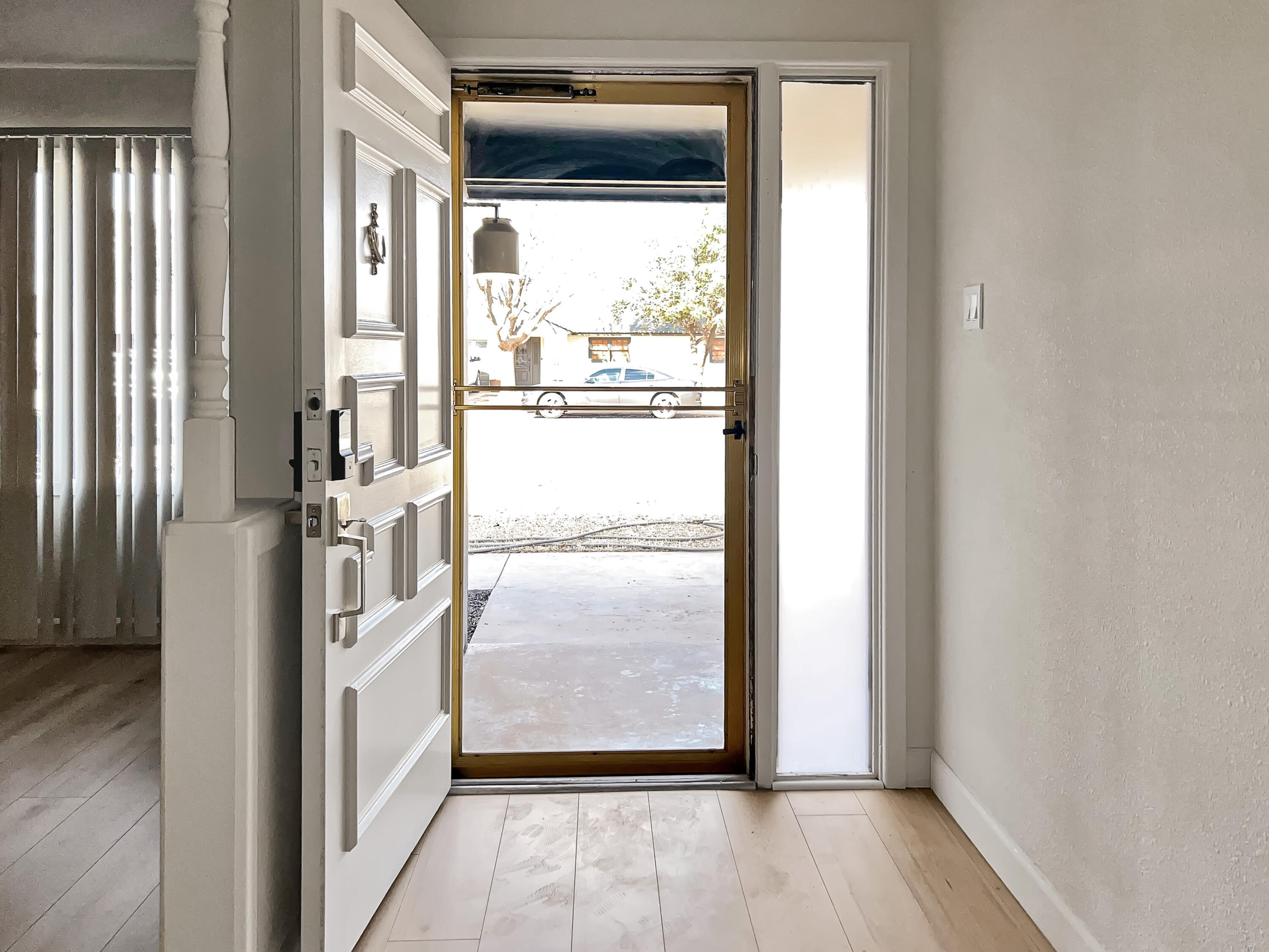 3827 52nd Street Lubbock, TX 79413 - Photo 3 of 24 a view of entryway with wooden floor
