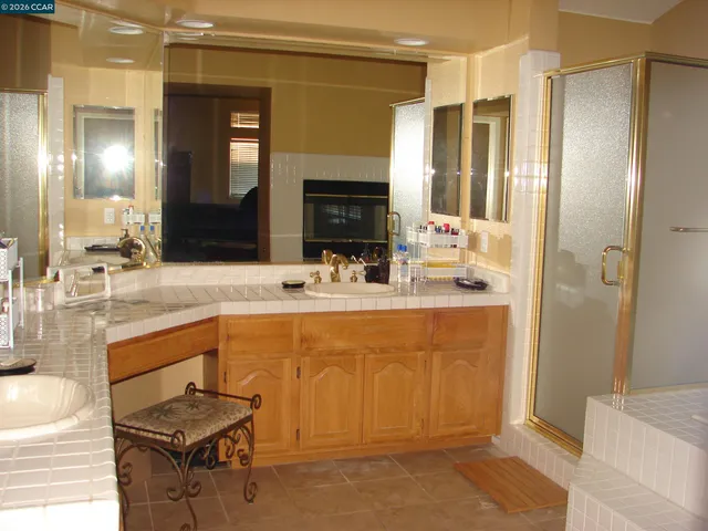 a bathroom with a bathtub and a shower
