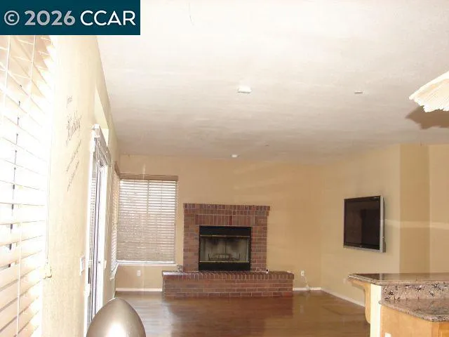 a view of a living room with a large window