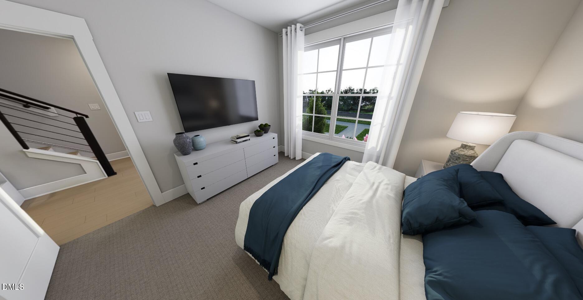 2401 Adrift Road Fuquay-Varina, NC 27526 - Photo 10 of 24 a bedroom with a bed and flat screen tv