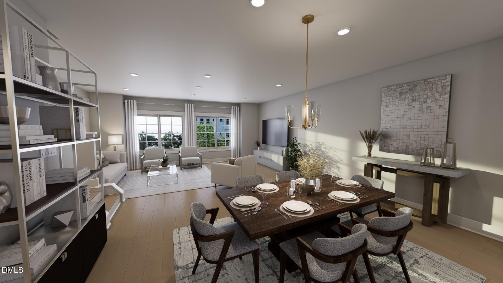 2401 Adrift Road Fuquay-Varina, NC 27526 - Photo 12 of 24 a view of a dining room and livingroom with furniture wooden floor a chandelier