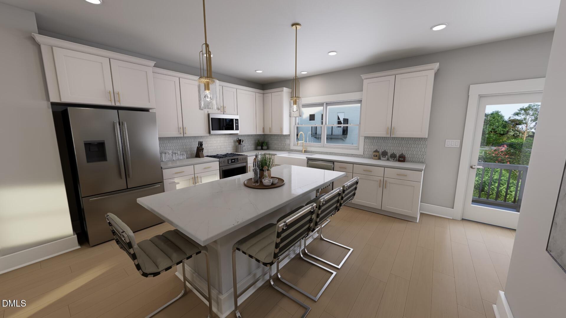 2401 Adrift Road Fuquay-Varina, NC 27526 - Photo 3 of 24 a kitchen with white cabinets and stainless steel appliances