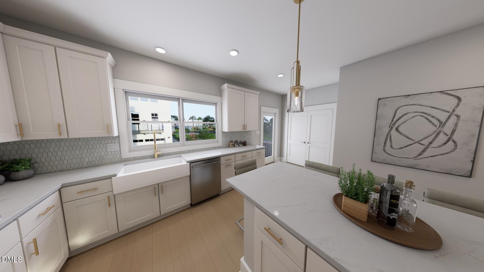 2401 Adrift Road Fuquay-Varina, NC 27526 - Photo 5 of 24 a kitchen with white cabinets and window