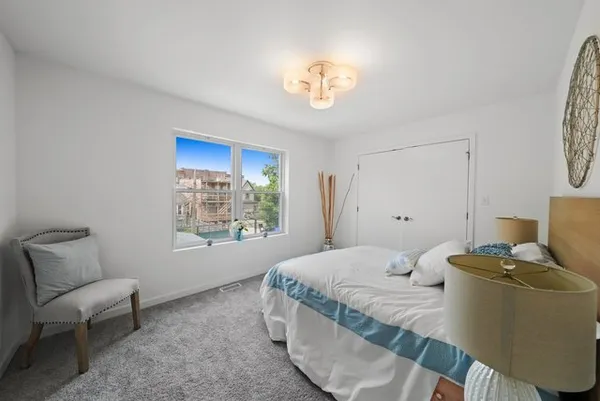 a room with a bed and a chair