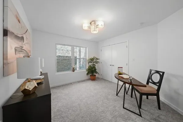 a livingroom with furniture and a chandelier