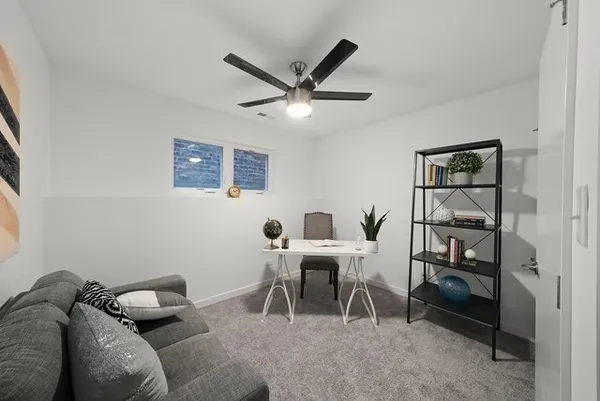 a work room with furniture and a window