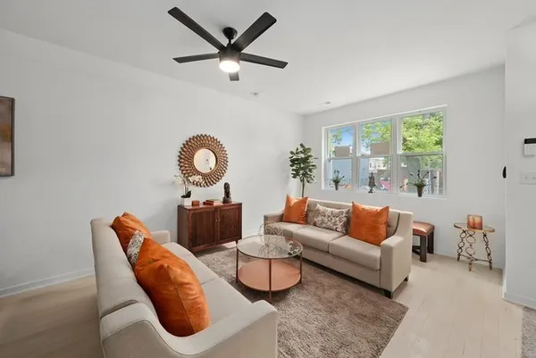 a living room with furniture and a large window