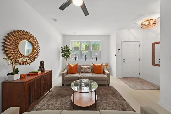 a living room with furniture and a large window