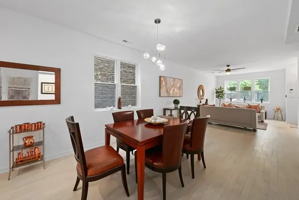 a view of a dining room with furniture and a livingroom