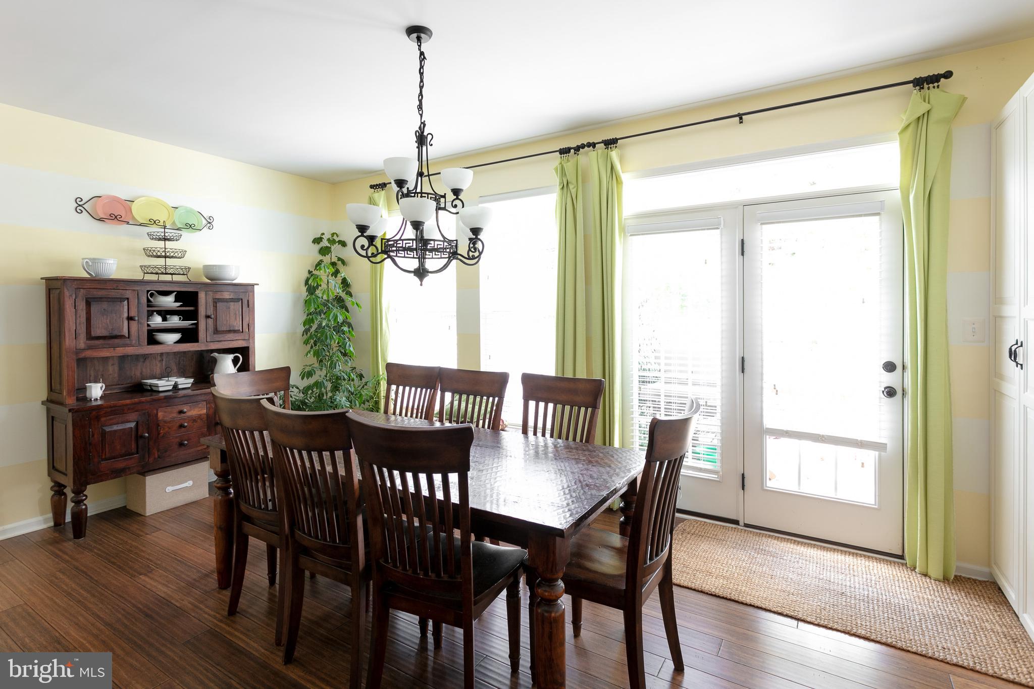 113 Riparian Lane Ranson, WV 25438 - Photo 16 of 31 Sun filled dining room leading to rear yard