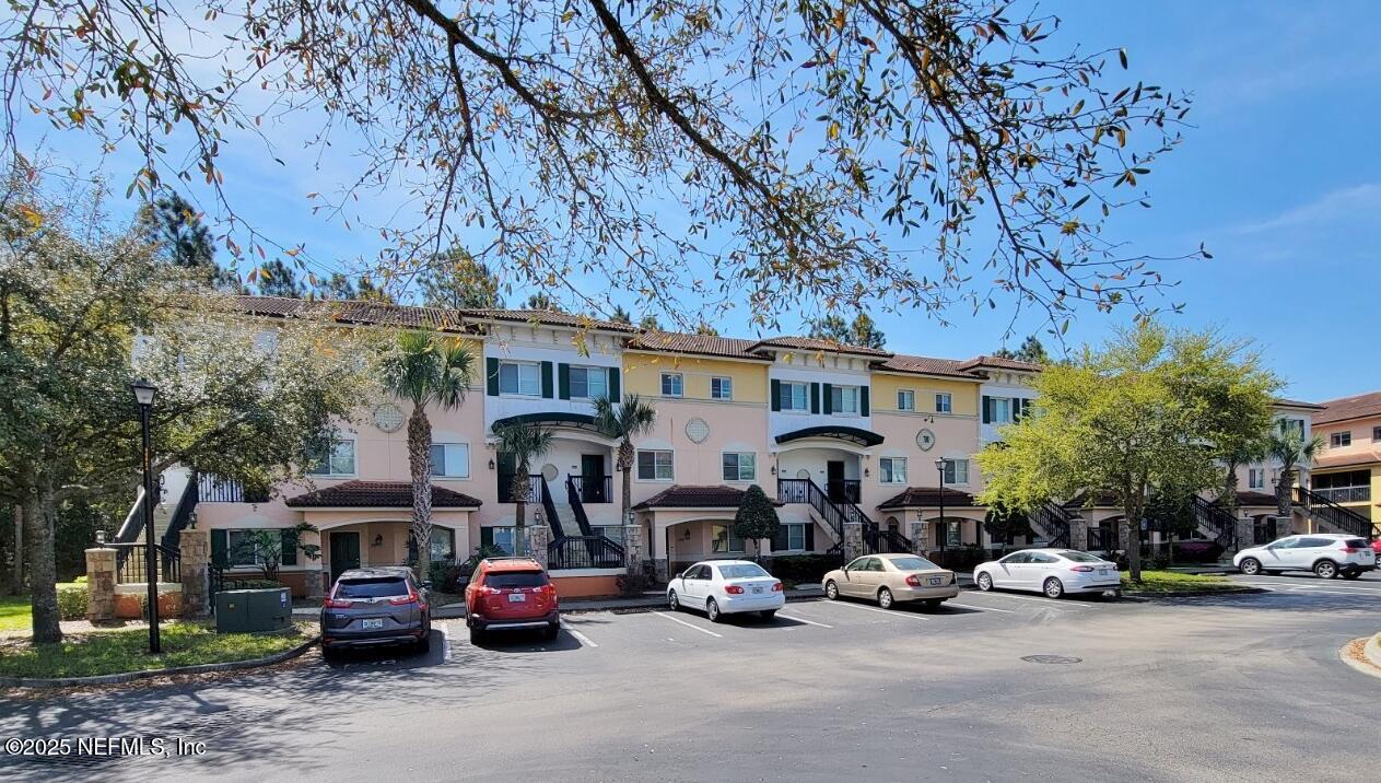 a view of a parked cars in front of a building