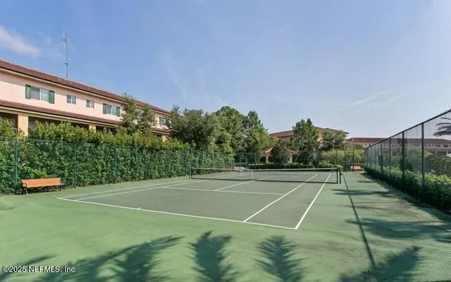 a view of a patio with a table chairs and a table