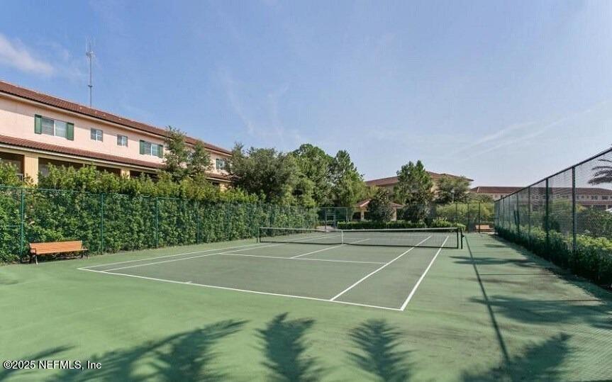 9745 Touchton Road, Unit 723 Jacksonville, FL 32246 - Photo 16 of 18 a view of an outdoor space and tennis court