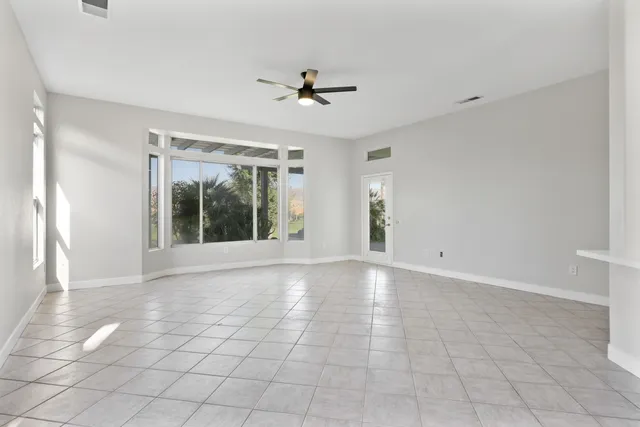 a view of an empty room and window