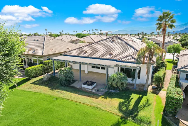 a view of house with a yard