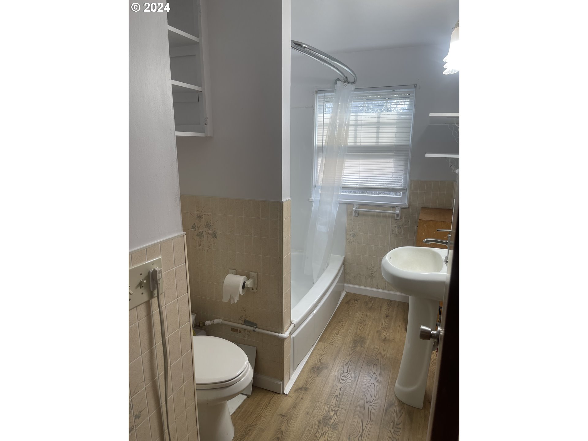 240 North Court Street Heppner, OR 97836 - Photo 13 of 19 a bathroom with a granite countertop toilet and a sink