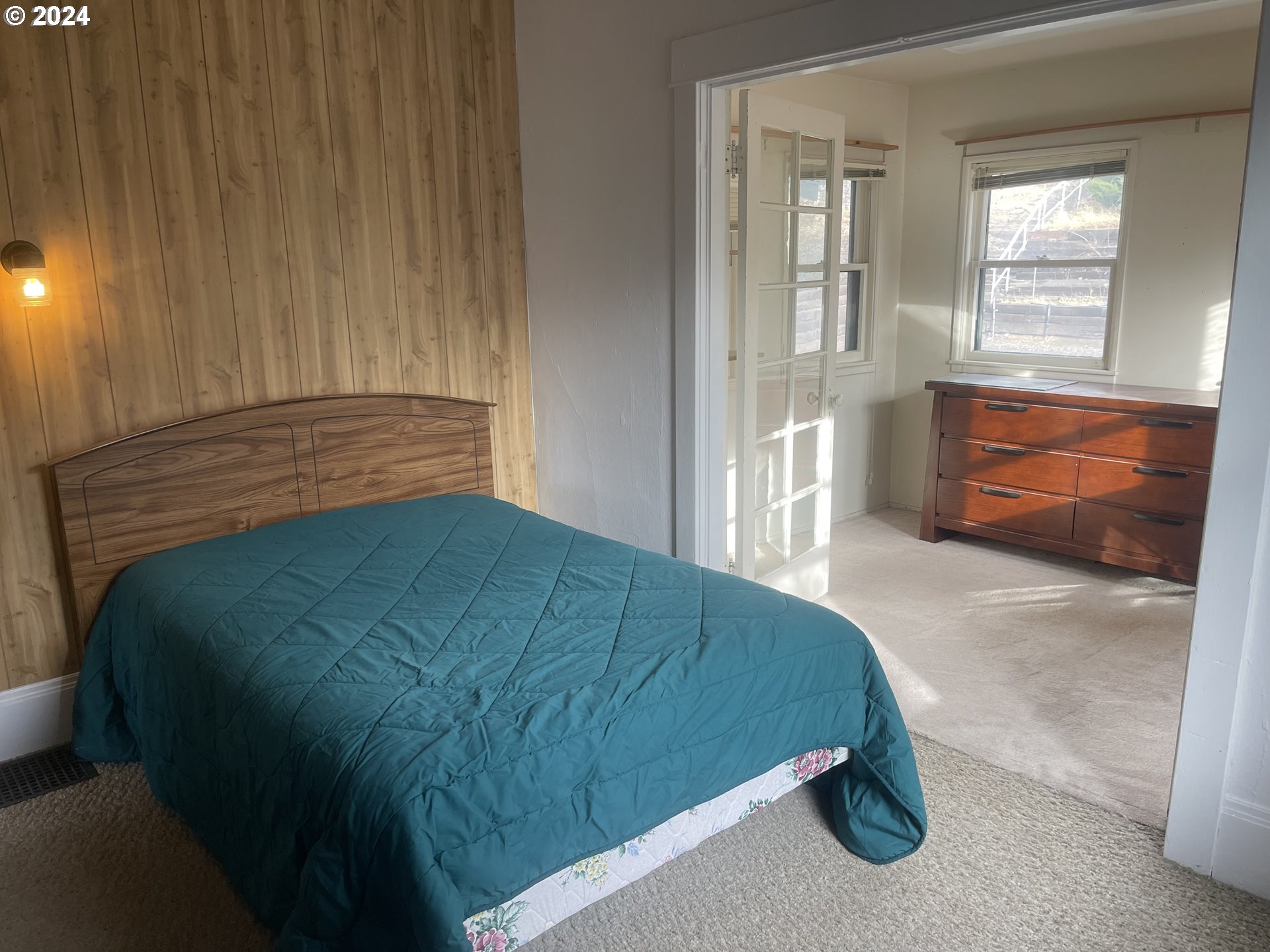 240 North Court Street Heppner, OR 97836 - Photo 6 of 19 a bedroom with a bed and window