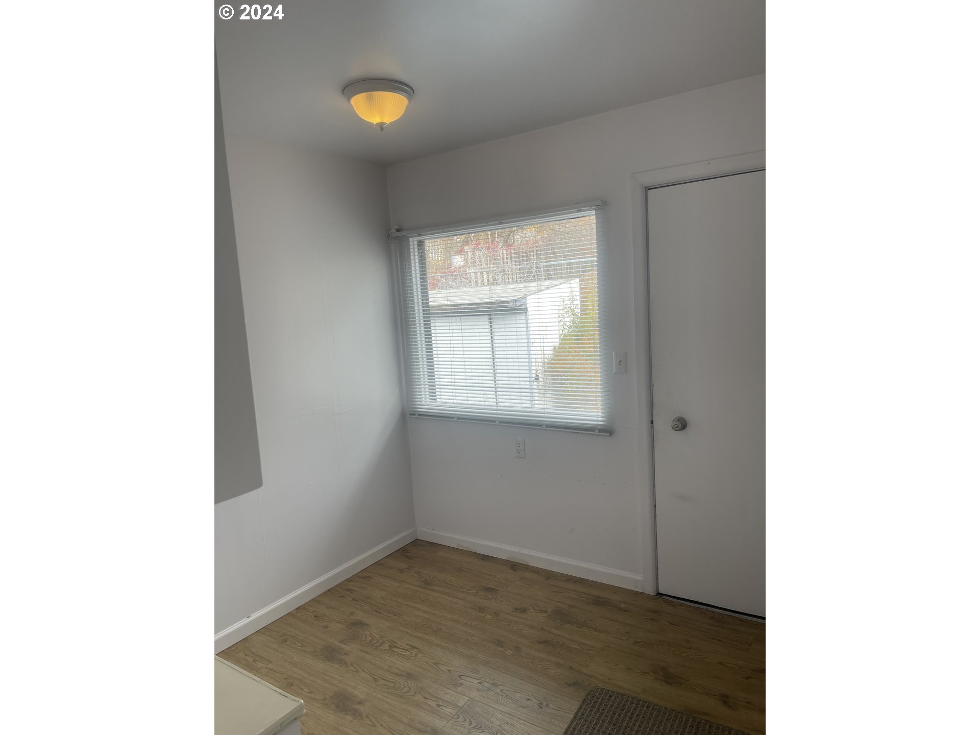 240 North Court Street Heppner, OR 97836 - Photo 9 of 19 a view of an empty room with closet and a window