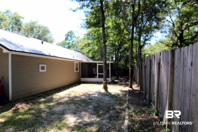 103 Jean Circle Daphne, AL 36526 - Photo 4 of 12 Back Yard is fenced and boasts a large screened porch and double gate for easy access.