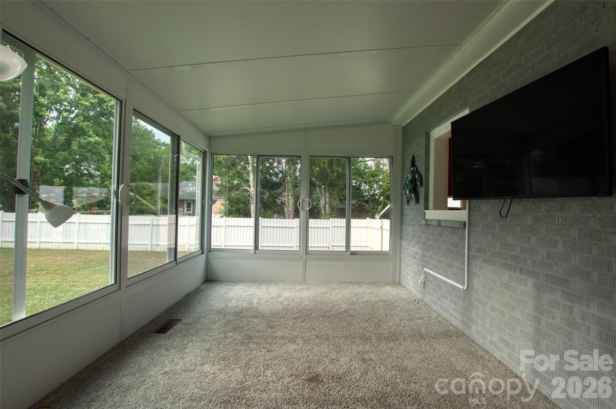 204 Clinton Avenue Clover, SC 29710 - Photo 18 of 26 a view of empty room with large windows