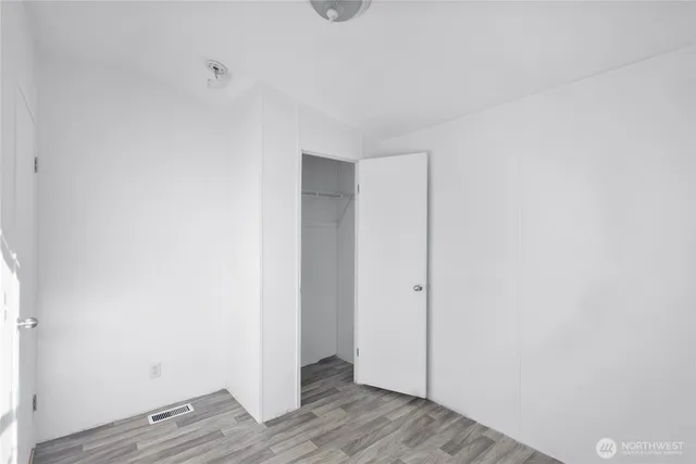 a view of room with wooden floor