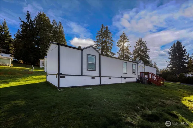 a house view with a sitting space and garden