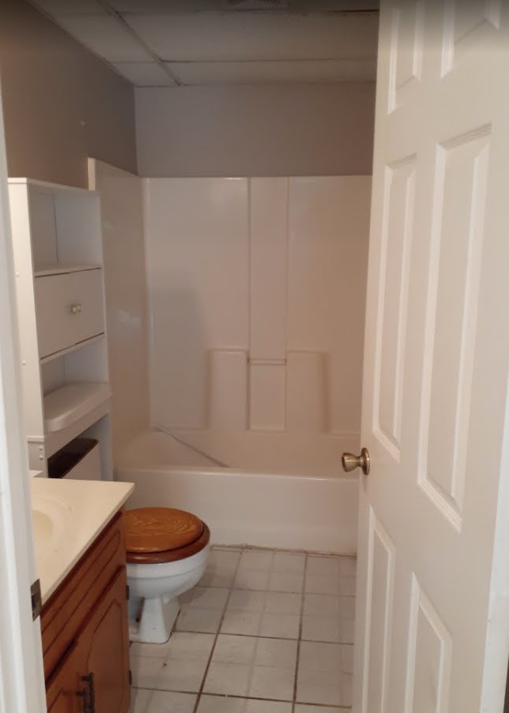 85 Lawn Street, Unit D Clarksville, TN 37040 - Photo 4 of 5 a bathroom with a sink a toilet and shower